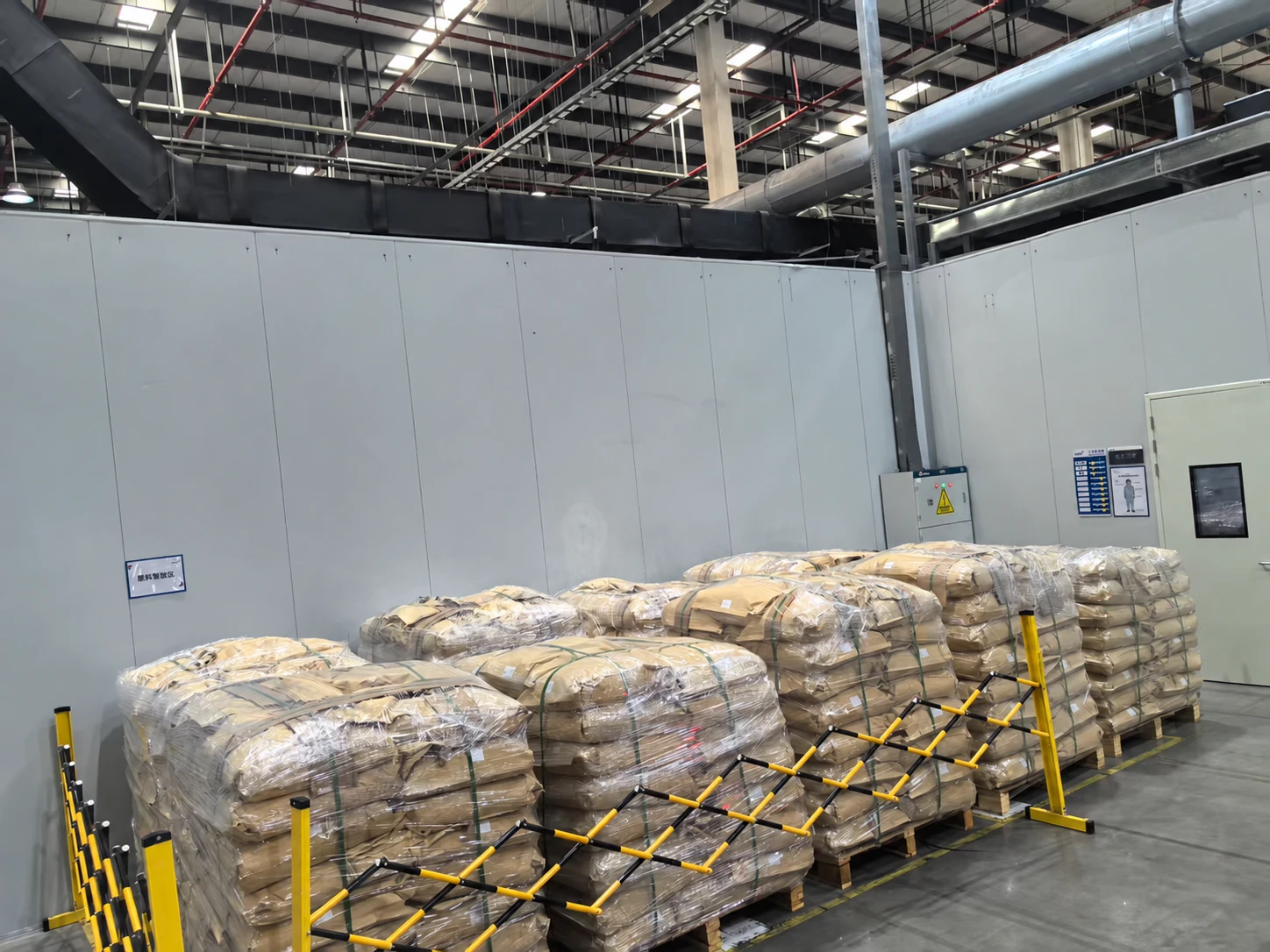 Palletized bags of material in warehouse